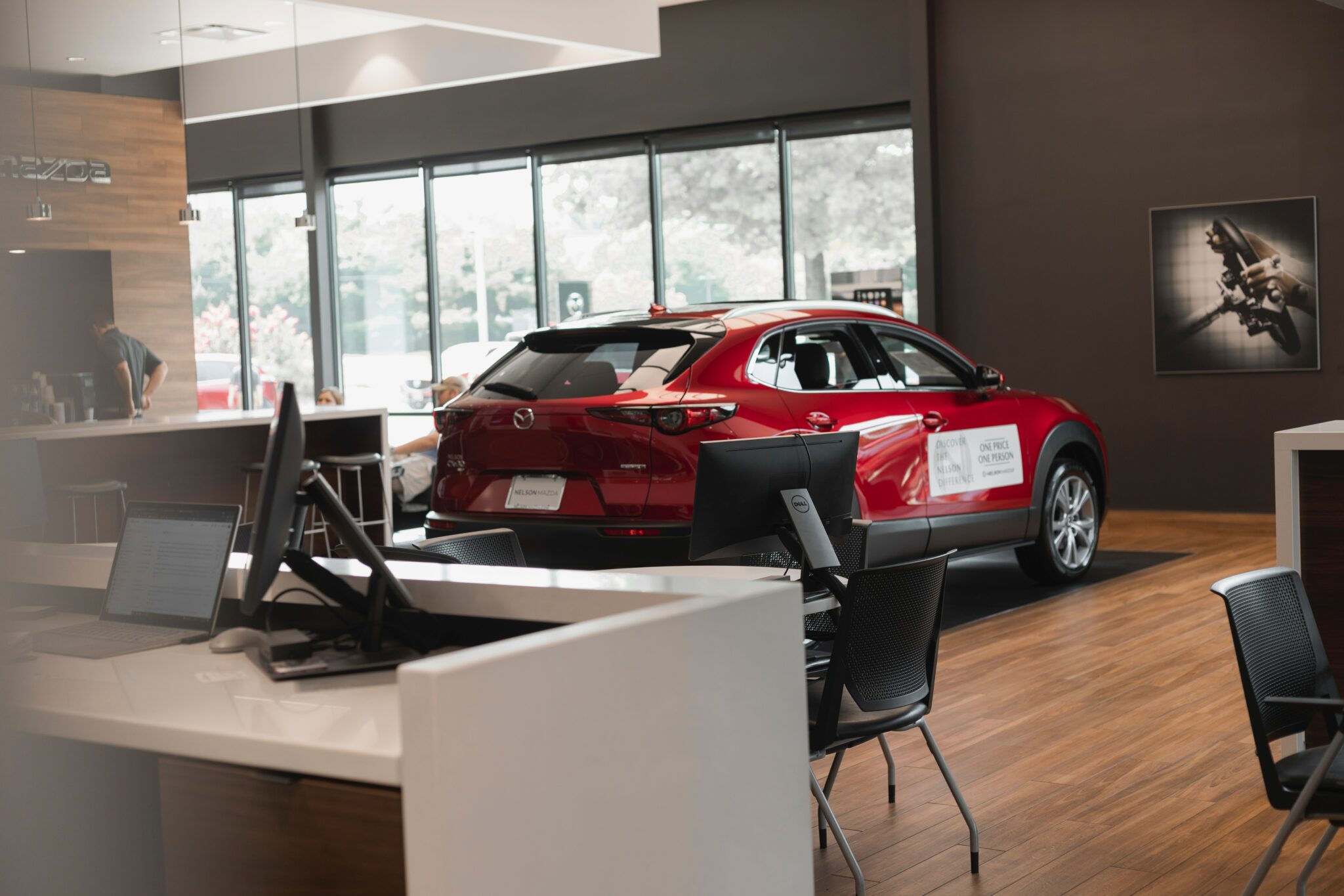 an image of a red car in a showroom