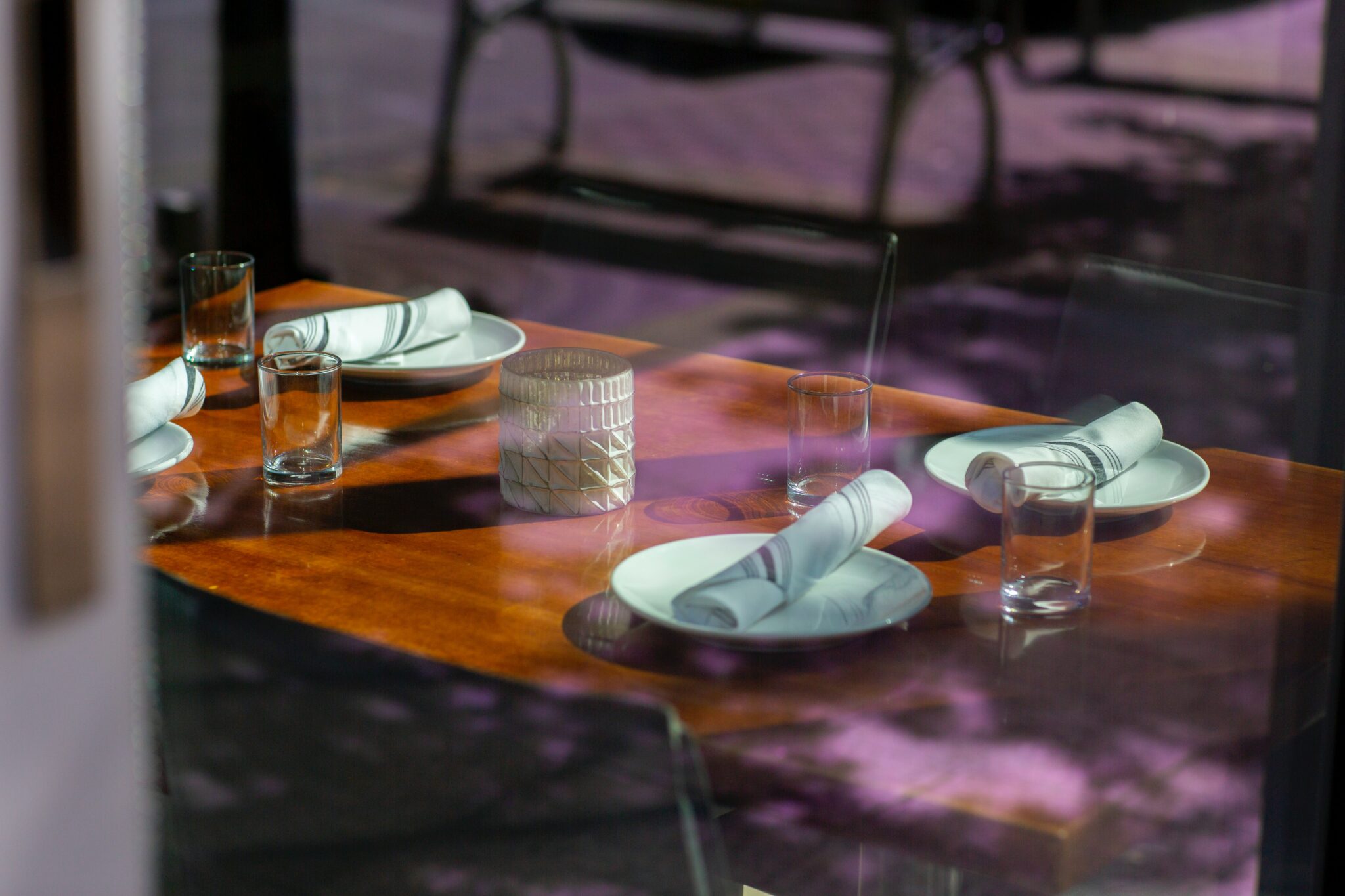 an image of a table set through a window for the page collecting bank transfer payments as a hospitality business