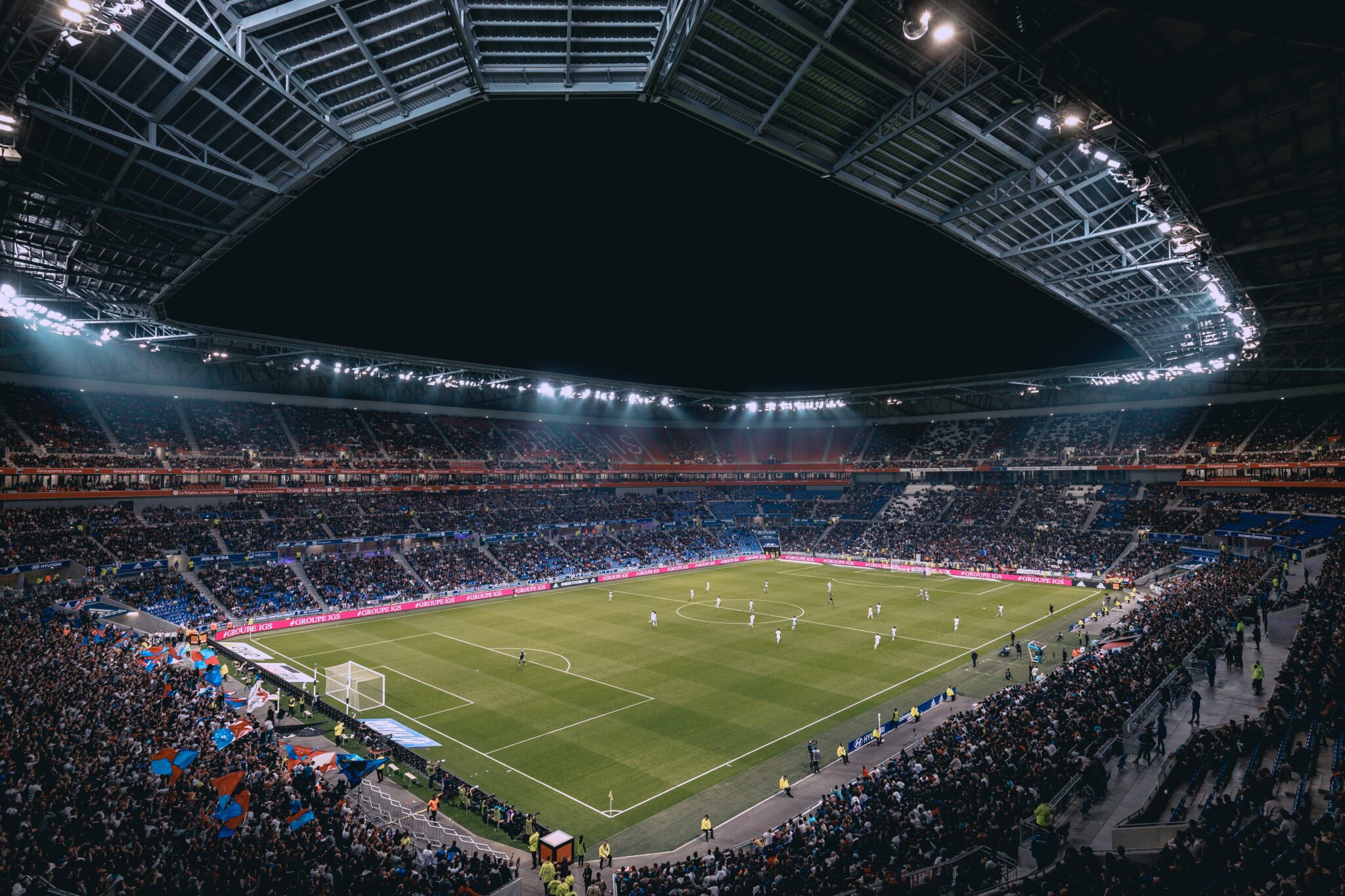 An image of a sports stadium full at night for the page sports stadium bank transfer